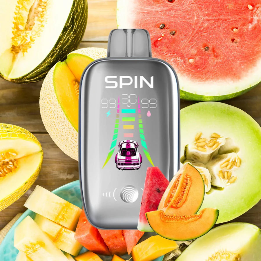 SPIN 40K bottle with watermelon, honeydew, and cantaloupe slices in a colorful display.